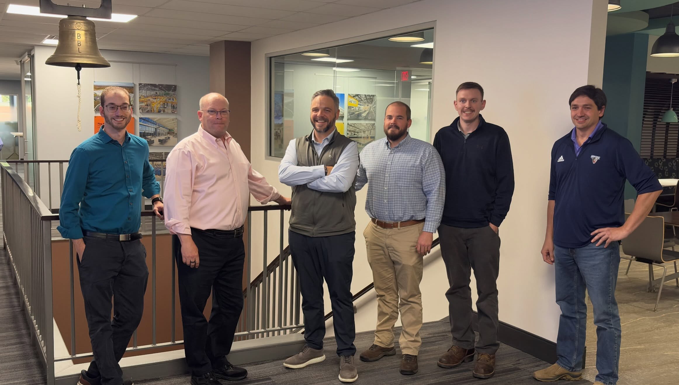 Sunrise President Jesse Holland with the BBL Construction Services team at the bell ringing for The Eastline Apartments construction contract